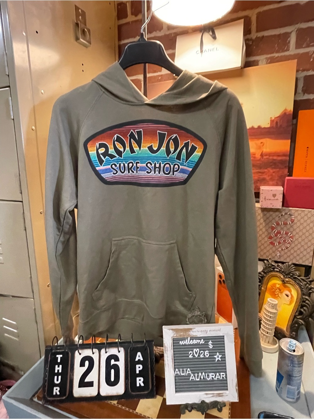 Ron Jon Surf Shop hoodie with a rainbow-colored logo on the chest